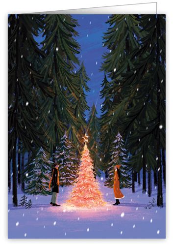 Couple around lit tree in snowy forest